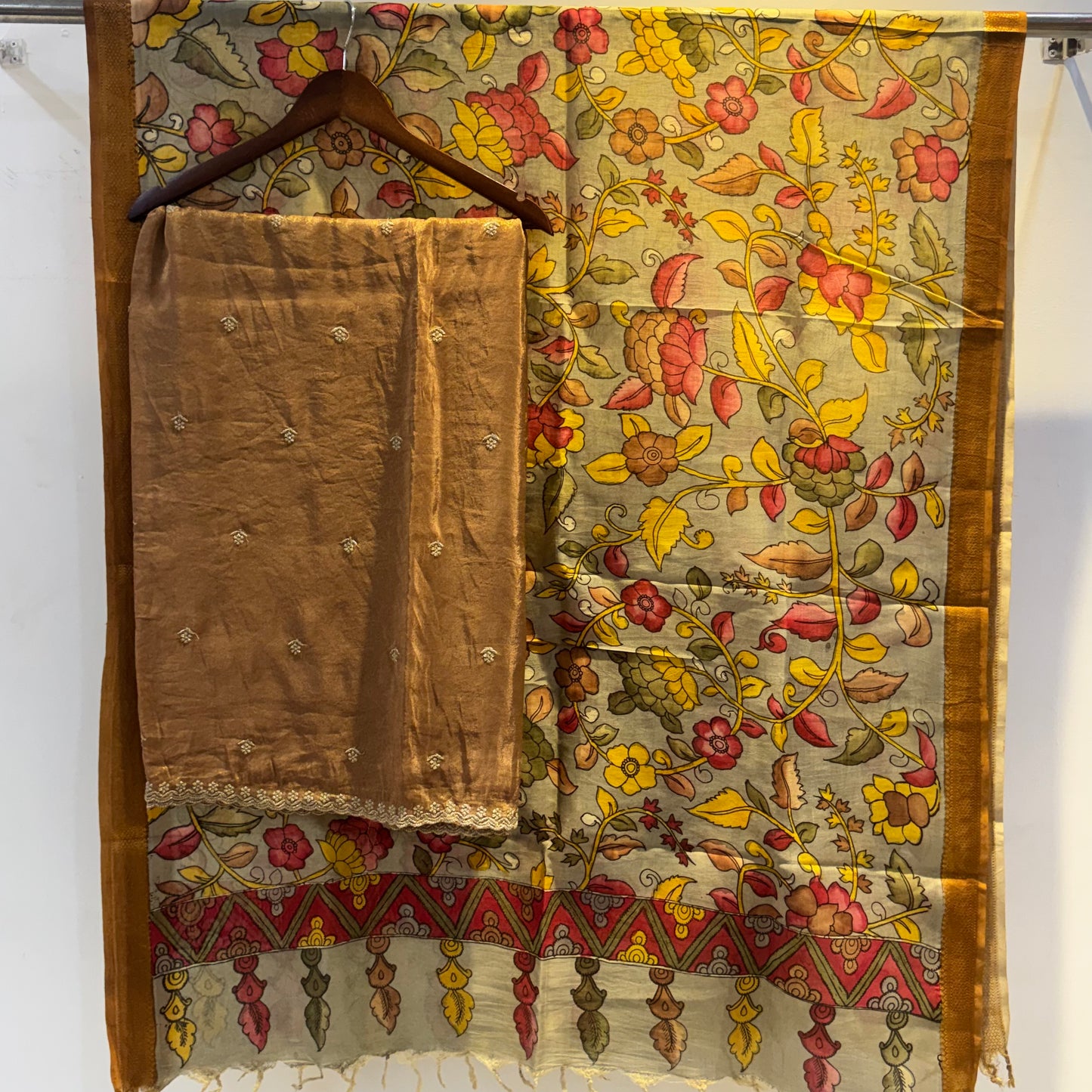 Golden Tissue suit paired with pen kalamkari duppata